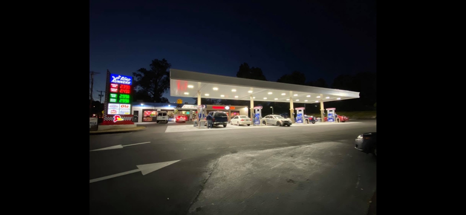 An actual RoadRunners station, with its illuminated canopy and convenience store at night